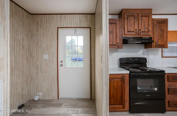 a kitchen with stainless steel appliances granite countertop a stove and a refrigerator
