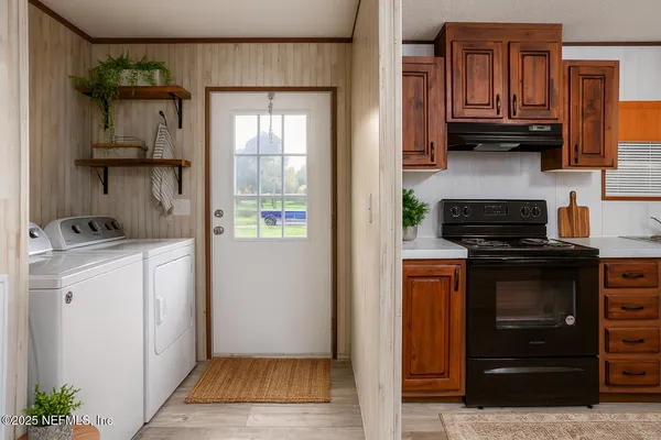 a kitchen with a refrigerator and a stove