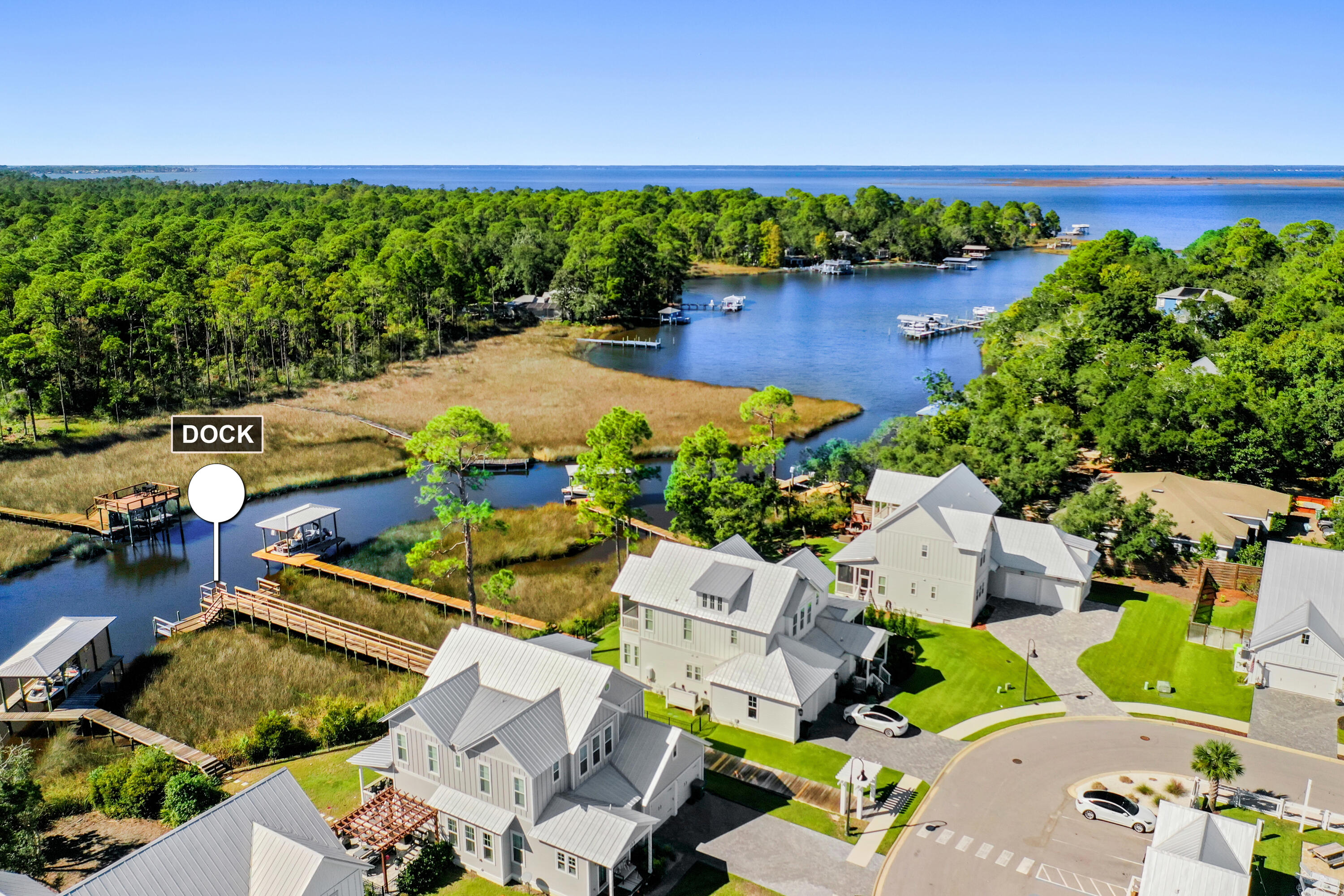 76 Bayou Edge Landing Santa Rosa Beach, FL 32459 - Photo 1 of 49 an aerial view of a house with garden space and a patio