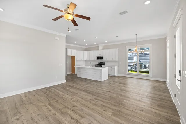 a view of kitchen with furniture and wooden floor