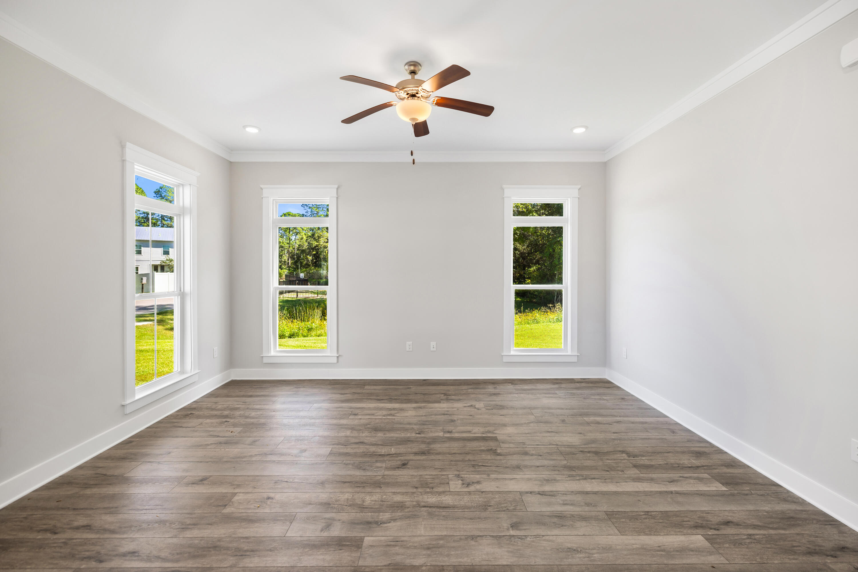 76 Bayou Edge Landing Santa Rosa Beach, FL 32459 - Photo 13 of 49 a view of an empty room with a window and wooden floor