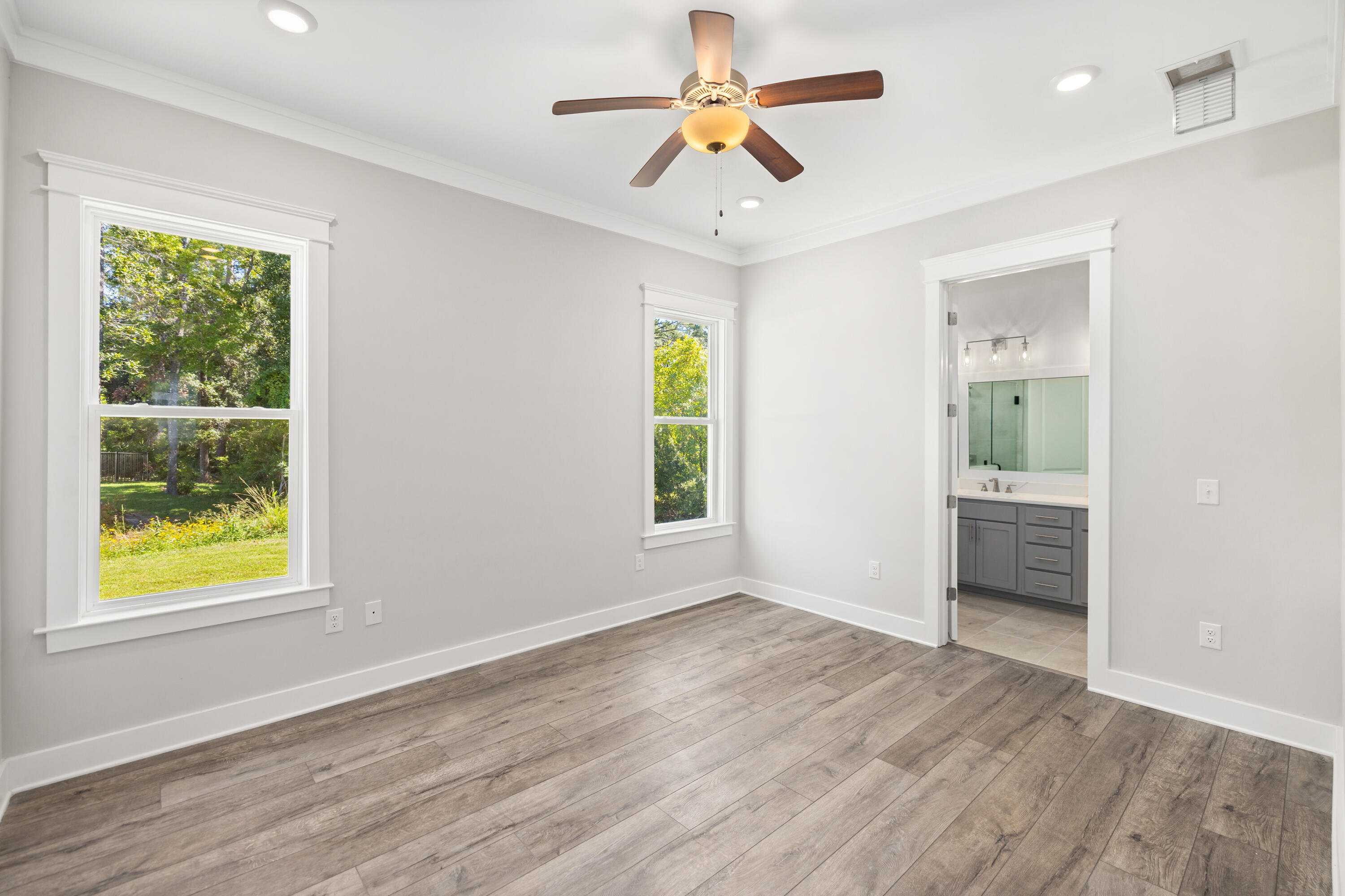 76 Bayou Edge Landing Santa Rosa Beach, FL 32459 - Photo 23 of 49 a view of an empty room with window and wooden floor