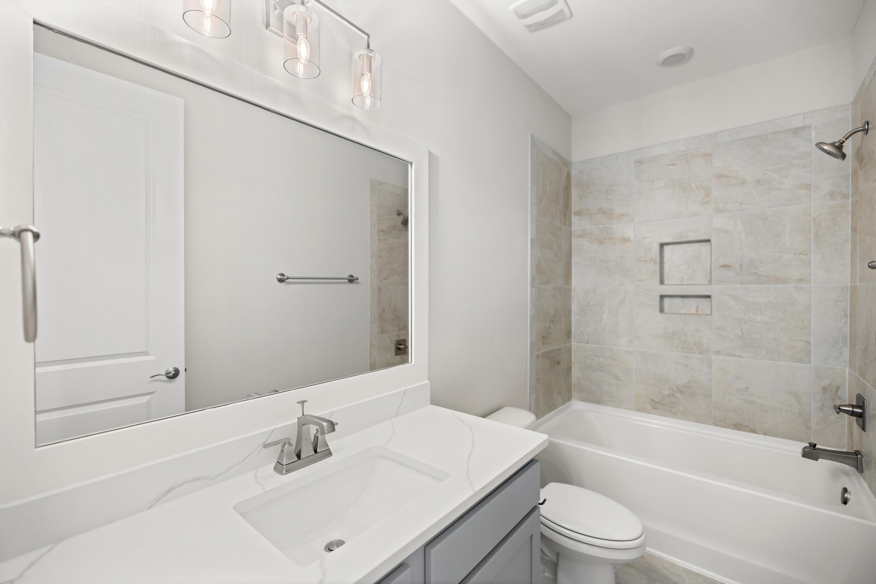 76 Bayou Edge Landing Santa Rosa Beach, FL 32459 - Photo 37 of 49 a bathroom with a bathtub shower sink vanity mirror and toilet