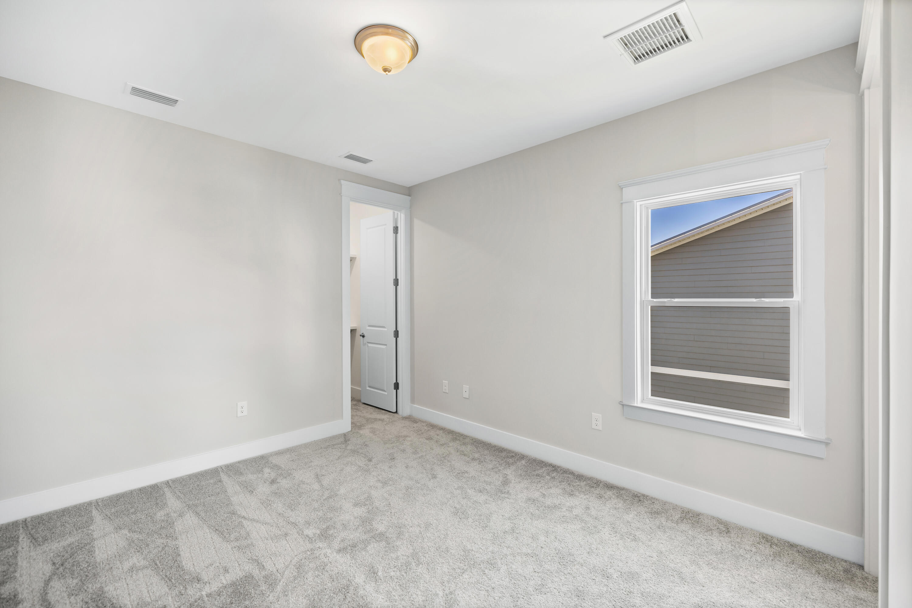 76 Bayou Edge Landing Santa Rosa Beach, FL 32459 - Photo 39 of 49 a view of an empty room with a window