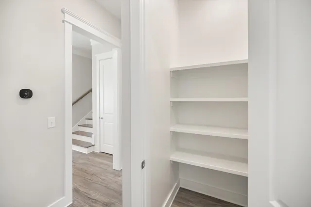 an aerial view of a house with a yard and potted plants
