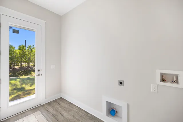 an aerial view of a residential houses with yard