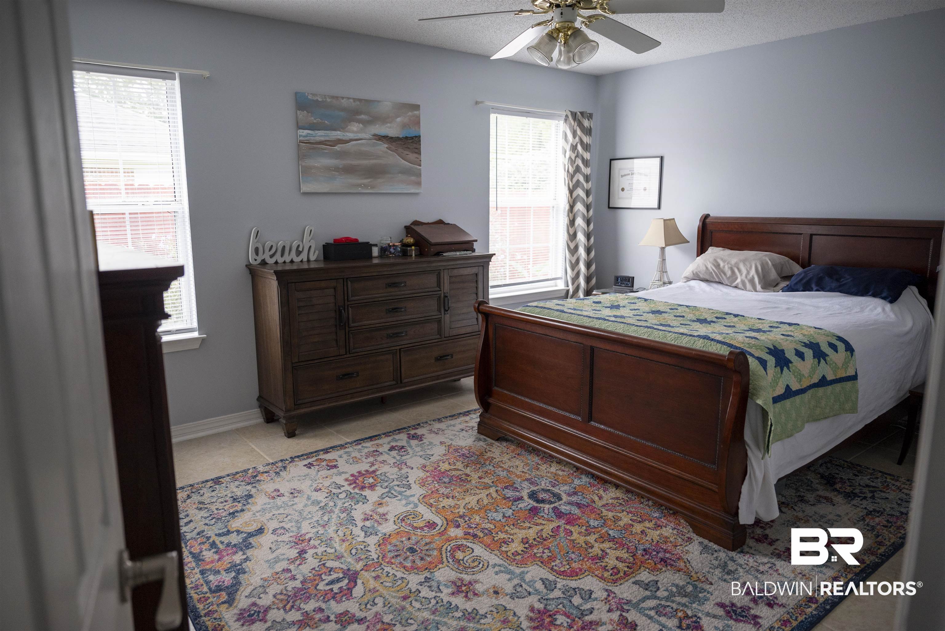 808 Wisteria Lane Foley, AL 36535 - Photo 11 of 19 Tiled bedroom featuring a textured ceiling and ceiling fan