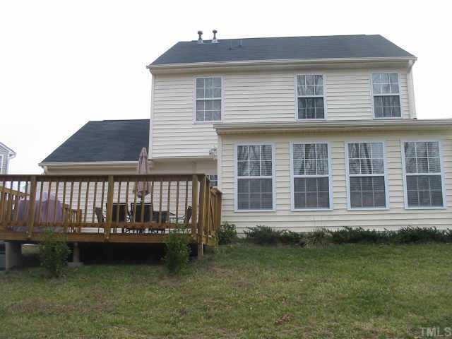 4802 Tapestry Terrace Durham, NC 27713 - Photo 12 of 12 a front view of a house with a garden