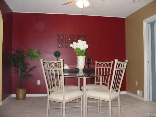 4802 Tapestry Terrace Durham, NC 27713 - Photo 7 of 12 a dining room with furniture and window