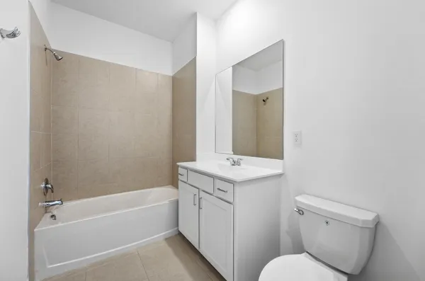 a bathroom with a toilet sink and bathtub