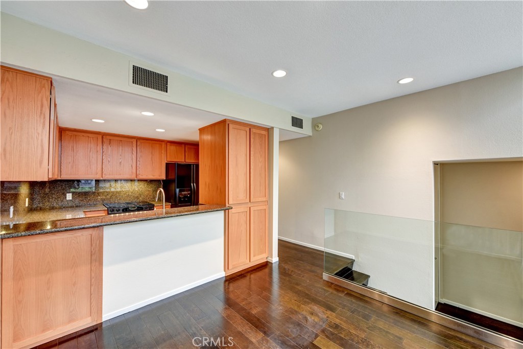6316 Marina Pacifica Drive North Long Beach, CA 90803 - Photo 4 of 21 a kitchen with stainless steel appliances granite countertop a refrigerator and a sink