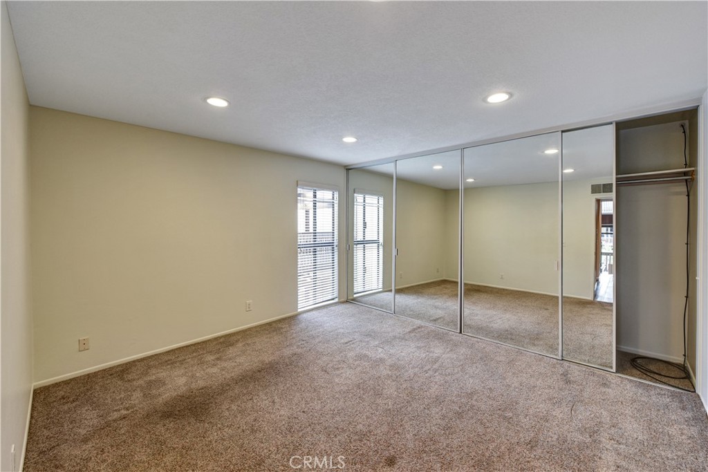 6316 Marina Pacifica Drive North Long Beach, CA 90803 - Photo 9 of 21 a view of an empty room with windows