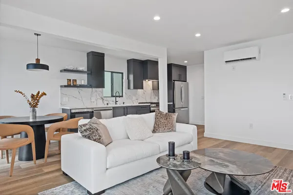 a living room with furniture and a table