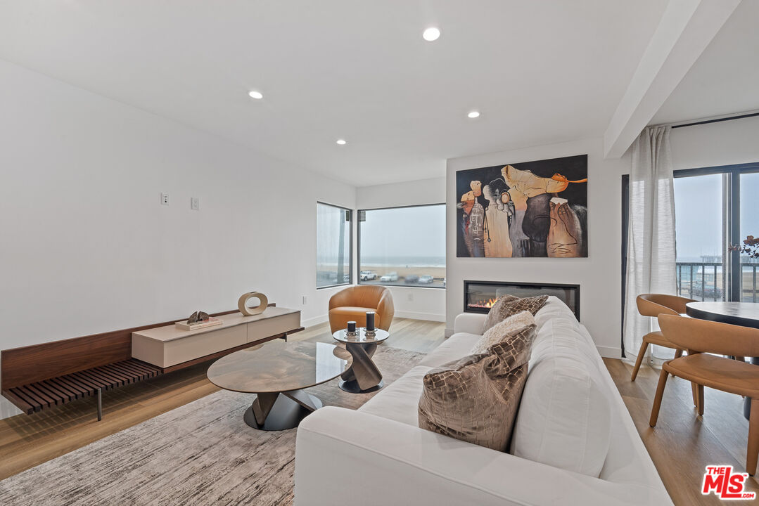 3305 Ocean Front Walk, Unit 2 Marina del Rey, CA 90292 - Photo 5 of 25 a living room with furniture and wooden floor