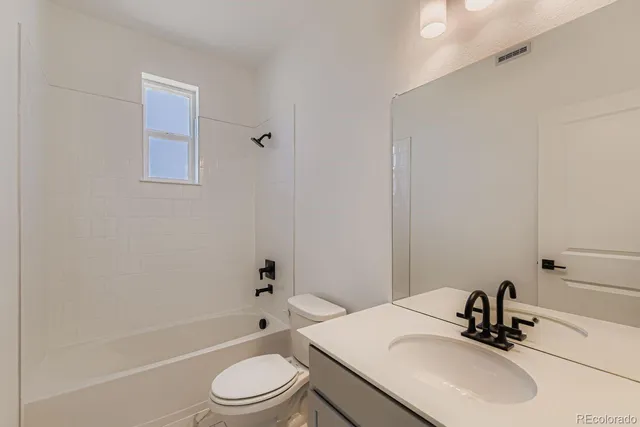 a bathroom with a sink toilet and a bathtub