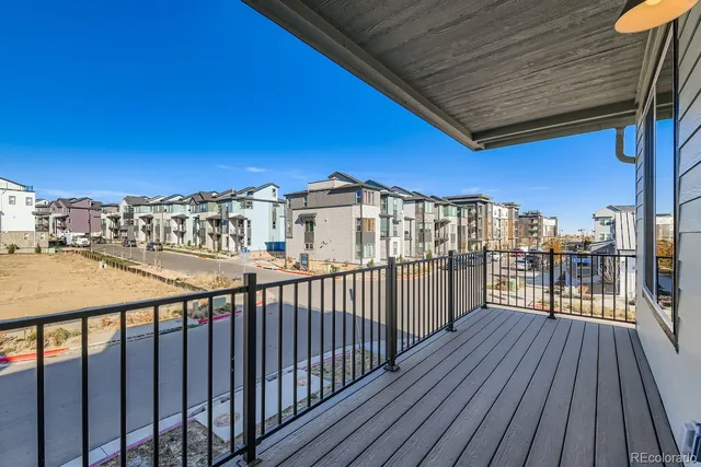 a view of a balcony with wooden floor