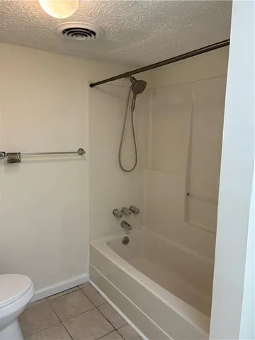 a bathroom with a bath tub and a shower