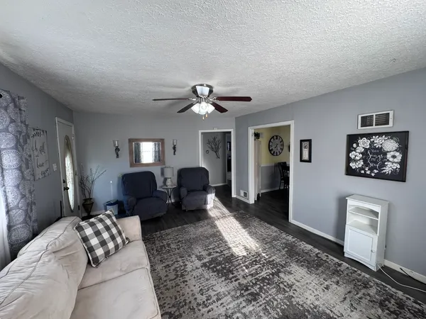 a living room with furniture and a rug