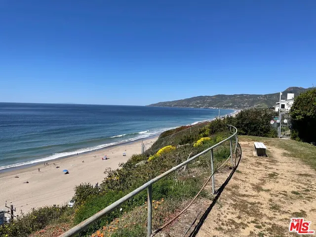 a view of a balcony with an ocean view