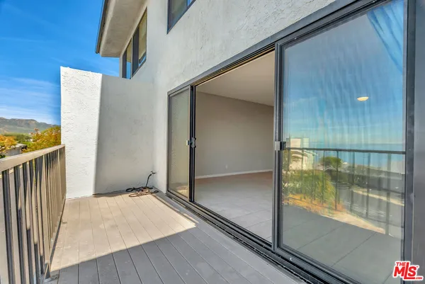 a kitchen with stainless steel appliances granite countertop a refrigerator and a stove