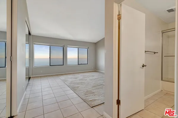 a view of an empty room and window