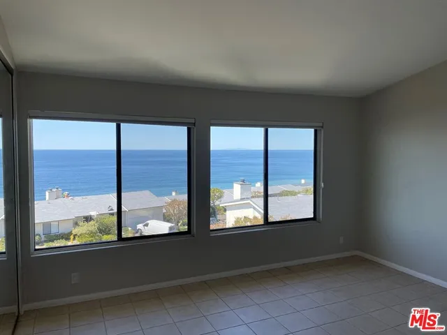 an empty room with a large window