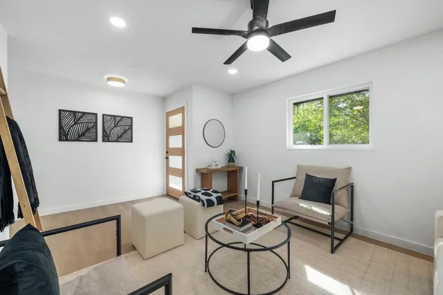 a living room with furniture and a window