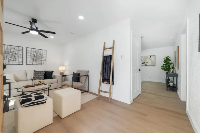 a kitchen with a stove a sink and a refrigerator