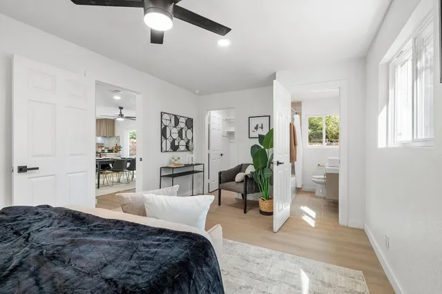 a bathroom with a tub a sink and a shower