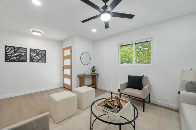 a living room with furniture and a table