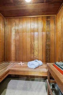 a living room with hardwood floor and a large window