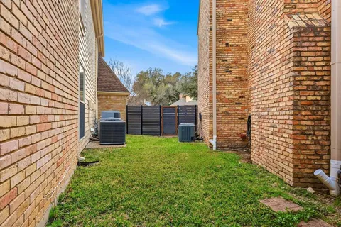a swimming pool with outdoor seating and yard