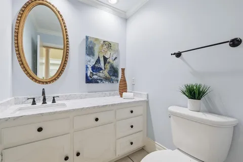 a kitchen with stainless steel appliances granite countertop a sink a stove and a wooden cabinets