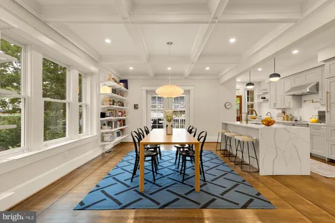 a kitchen with a sink a counter space and cabinets