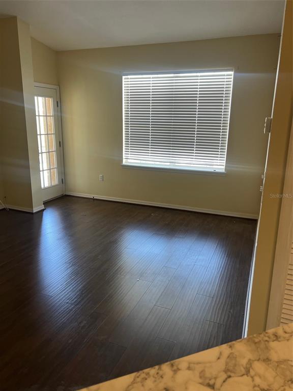 9122 Moonlit Meadows Loop, Unit 1 Riverview, FL 33578 - Photo 2 of 13 a view of empty room with wooden floor and fan