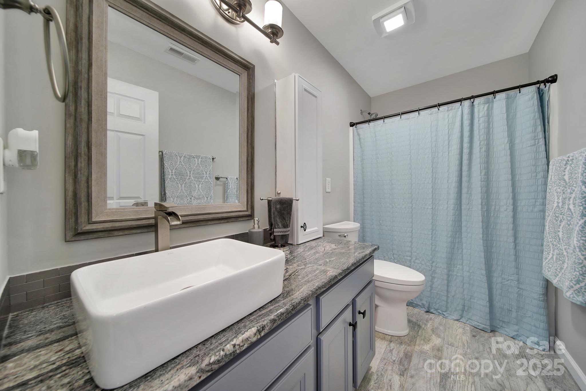 5515 Alexandrite Way Fort Mill, SC 29708 - Photo 31 of 48 a bathroom with a sink and a mirror