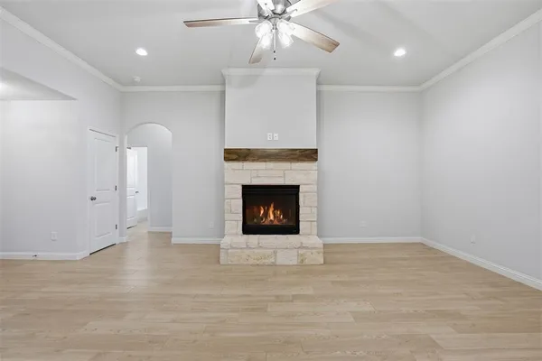 a view of an empty room with a fireplace