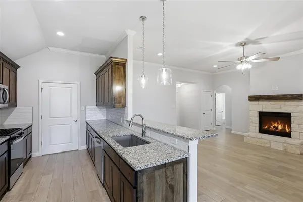 a kitchen with sink cabinets and outdoor space