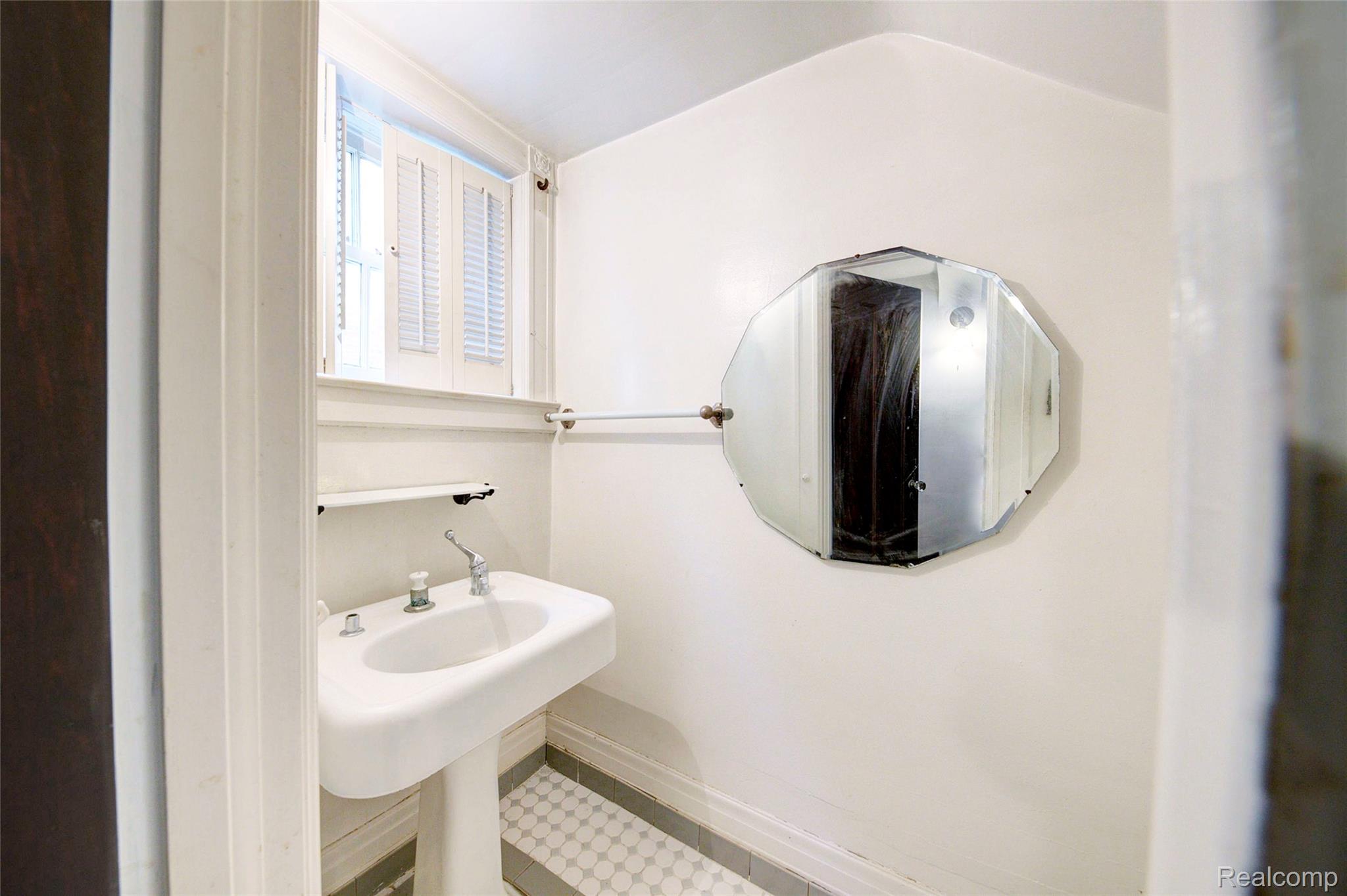 121 Longfellow Street Detroit, MI 48202 - Photo 73 of 87 Bathroom featuring a sink and vaulted ceiling
