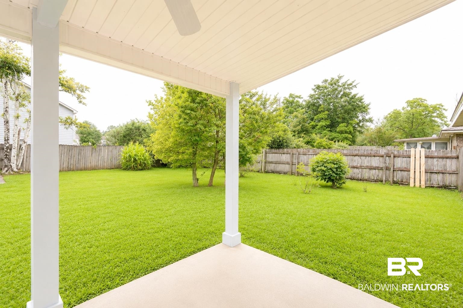 614 East Gate Circle Foley, AL 36535 - Photo 29 of 31 Covered patio featuring a ceiling fan, concrete flooring, and white support columns