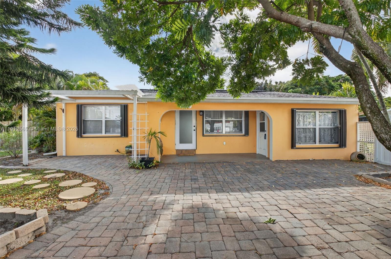 5172 Pine Tree Drive Delray Beach, FL 33484 - Photo 1 of 59 a house view with a outdoor space