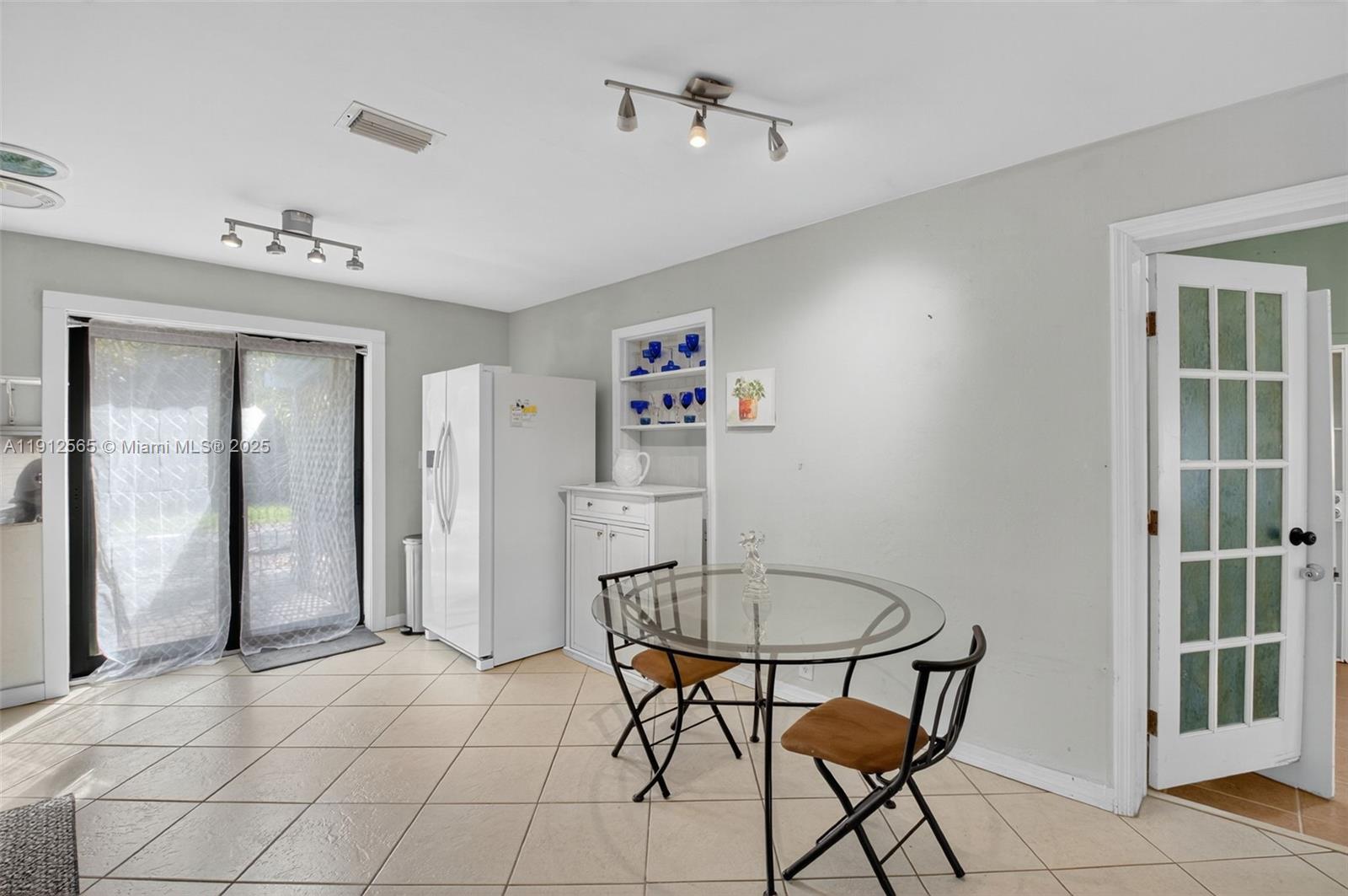 5172 Pine Tree Drive Delray Beach, FL 33484 - Photo 11 of 59 a view of a dining room with furniture