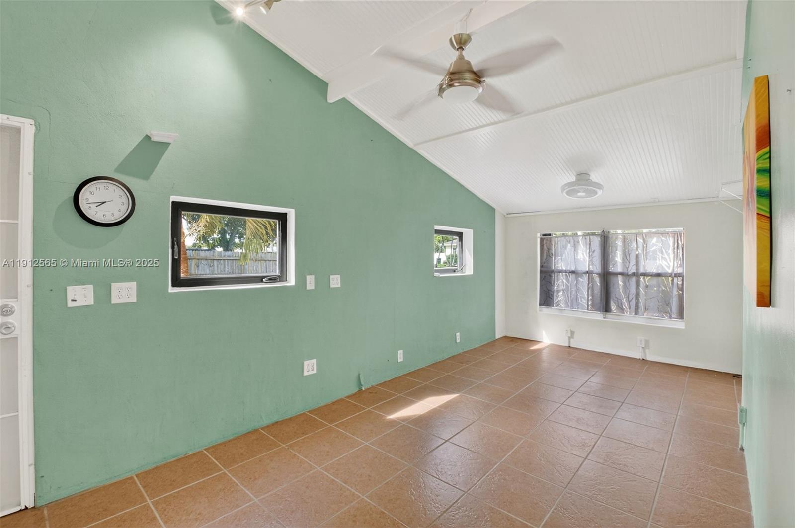 5172 Pine Tree Drive Delray Beach, FL 33484 - Photo 14 of 59 a view of an empty room with a window