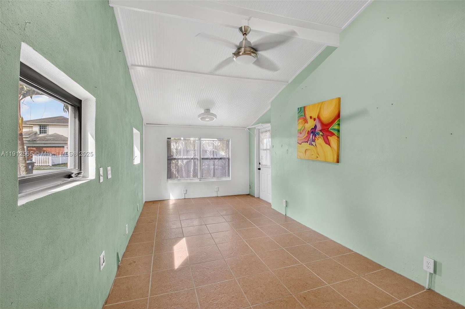 5172 Pine Tree Drive Delray Beach, FL 33484 - Photo 15 of 59 a view of an empty room with a window