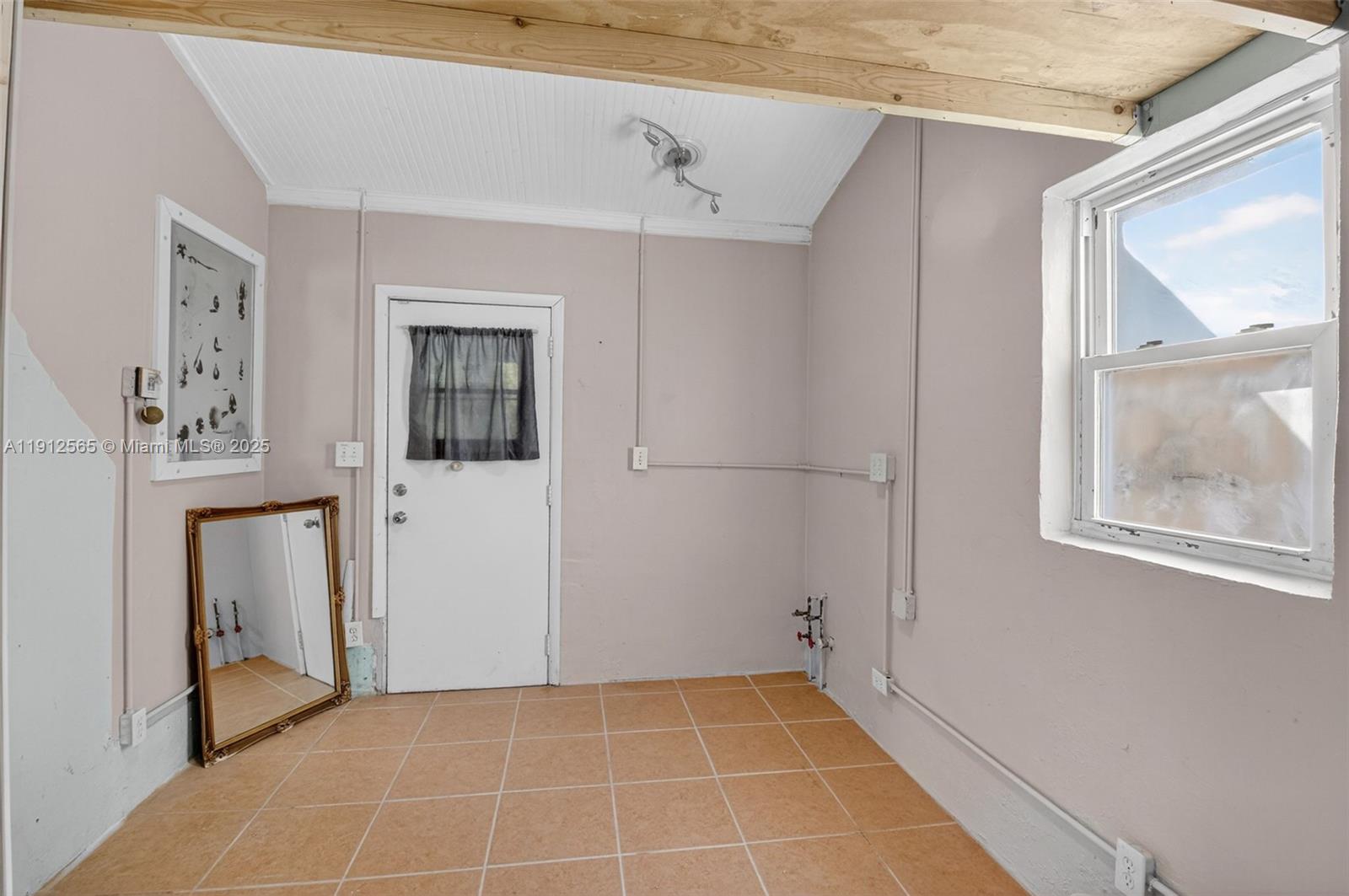 5172 Pine Tree Drive Delray Beach, FL 33484 - Photo 18 of 59 a view of an empty room with a window