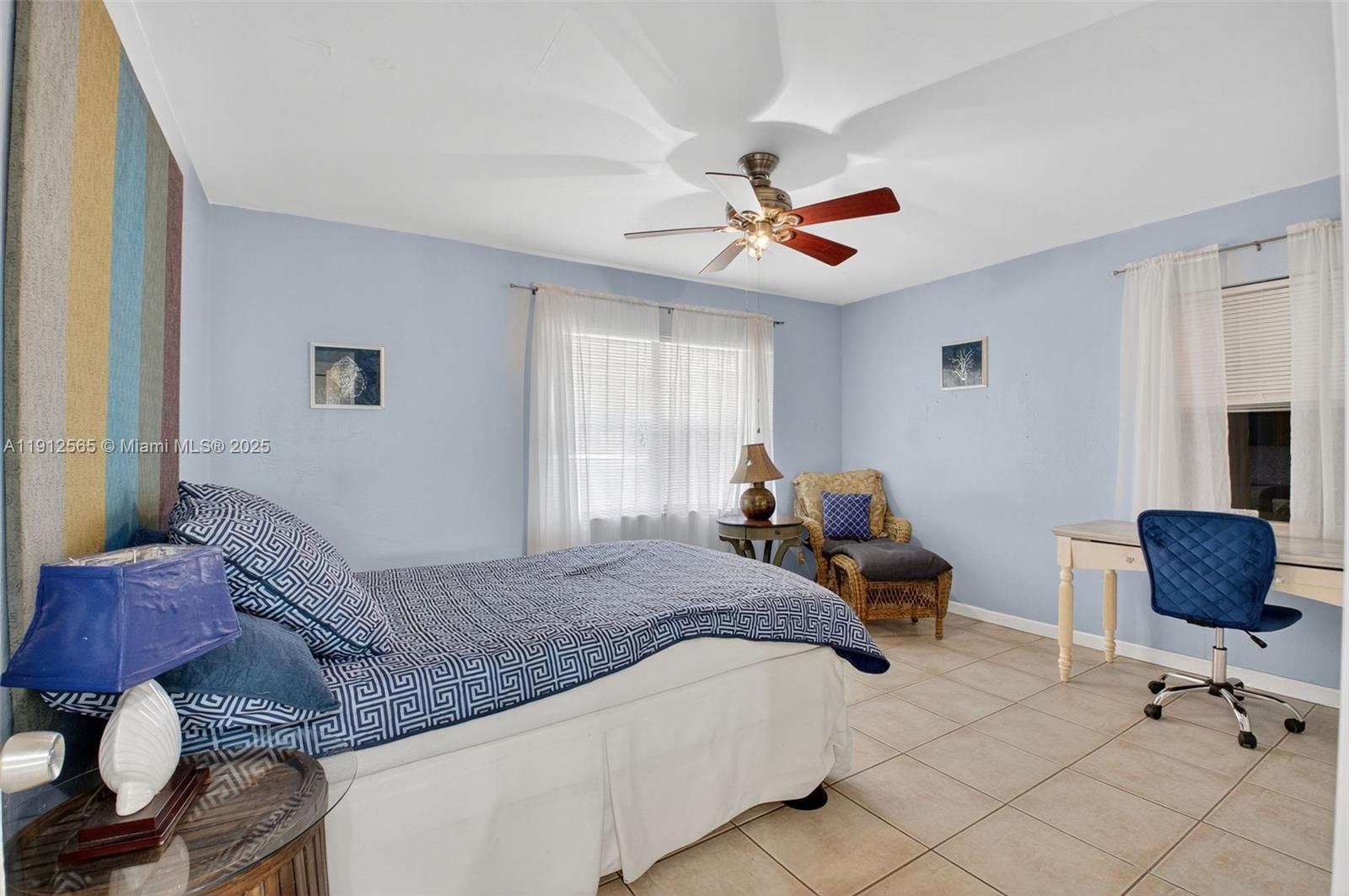 5172 Pine Tree Drive Delray Beach, FL 33484 - Photo 19 of 59 a bed room with a bed and a chair