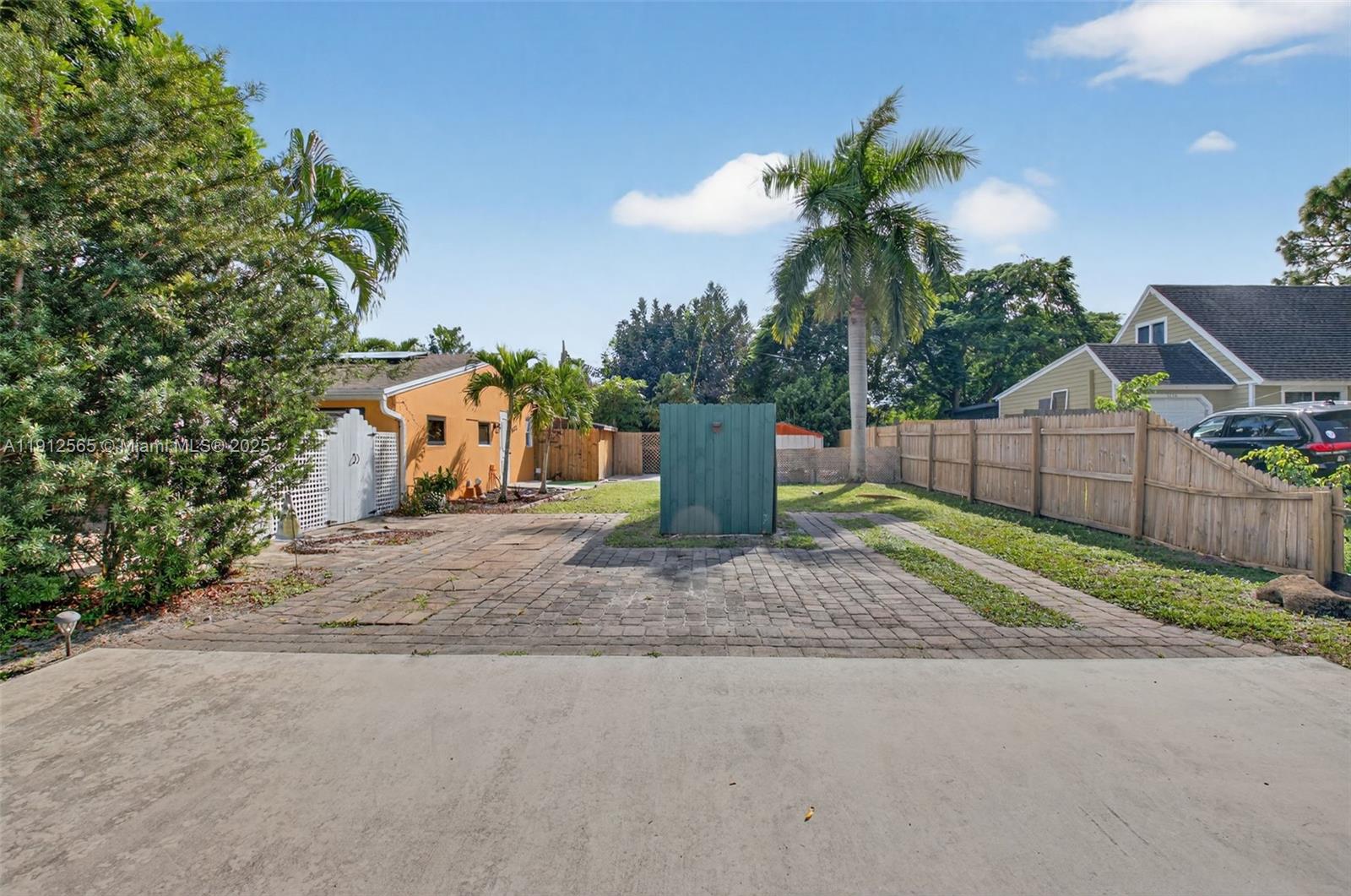5172 Pine Tree Drive Delray Beach, FL 33484 - Photo 29 of 59 a view of a backyard with plants