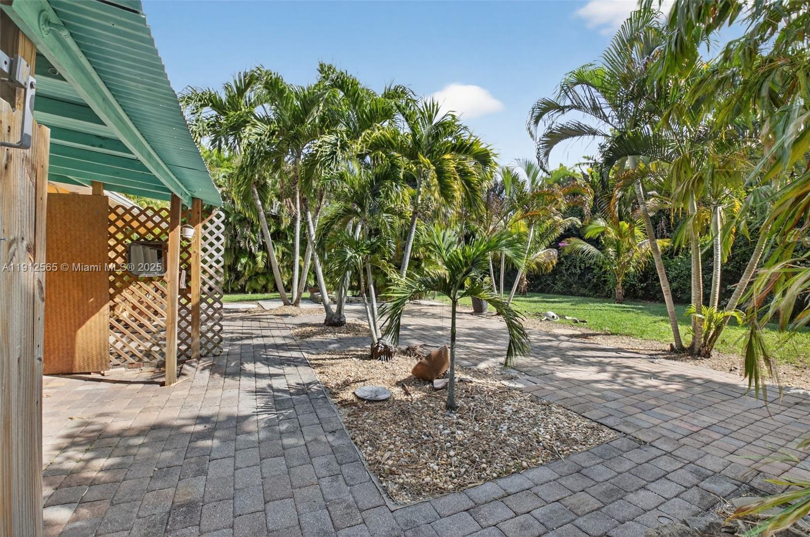 5172 Pine Tree Drive Delray Beach, FL 33484 - Photo 31 of 59 a view of backyard with green space