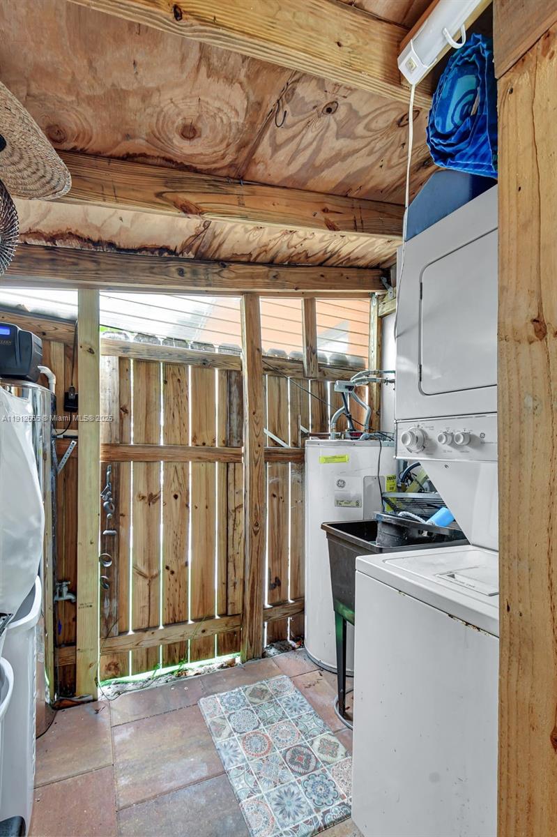 5172 Pine Tree Drive Delray Beach, FL 33484 - Photo 36 of 59 a storage room with washer and dryer