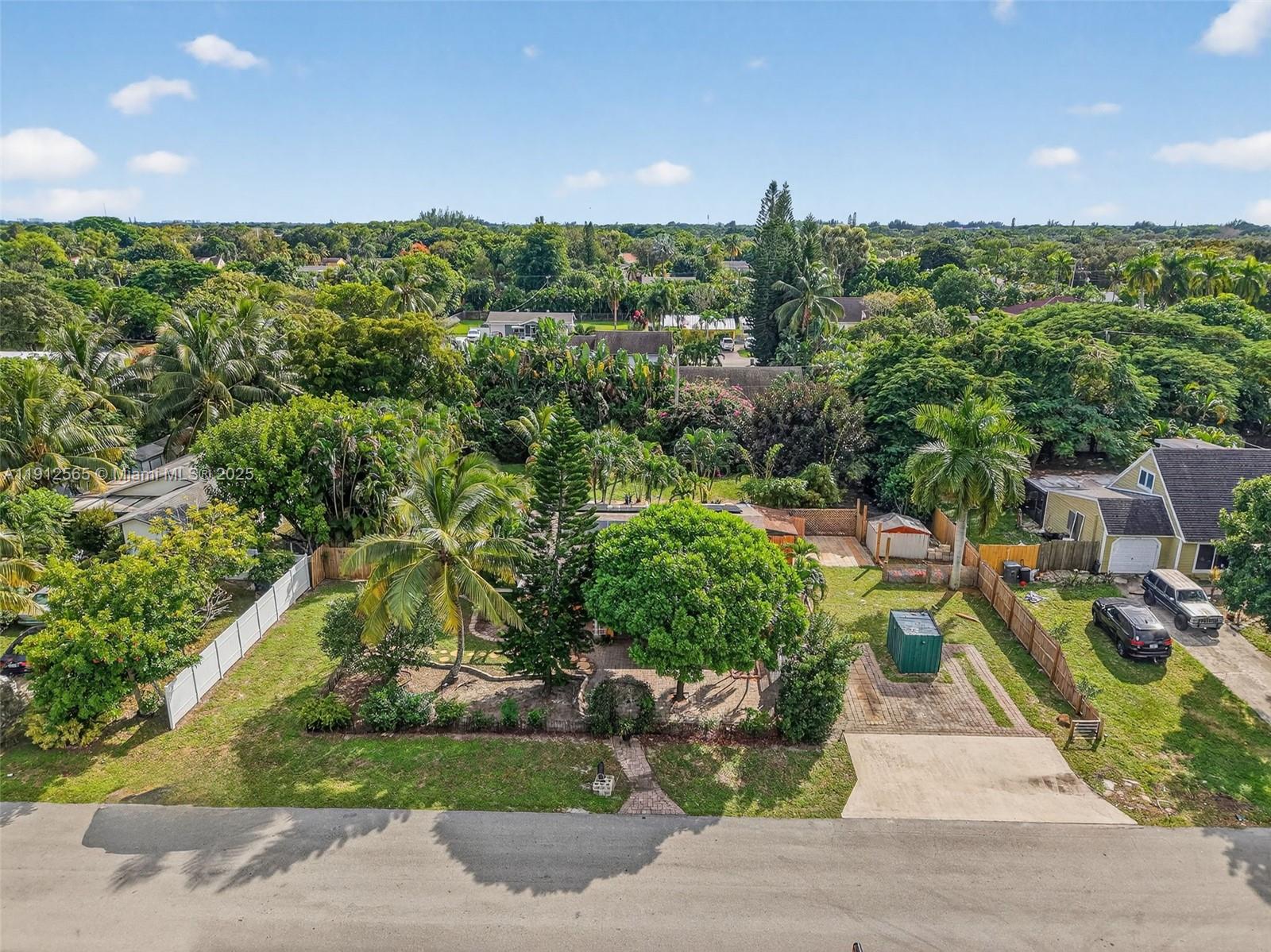 5172 Pine Tree Drive Delray Beach, FL 33484 - Photo 38 of 59 a view of a house with a garden